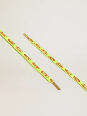 Fluorescent yellow laces with contrasting orange ‘Laces’ lettering