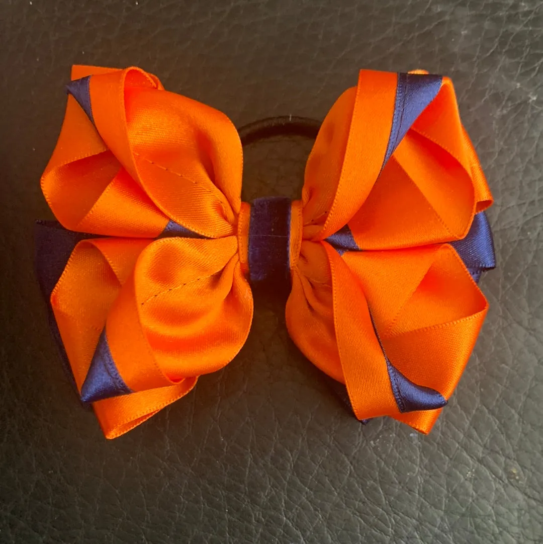 Luxury Bows: Orange and navy bows with twist design