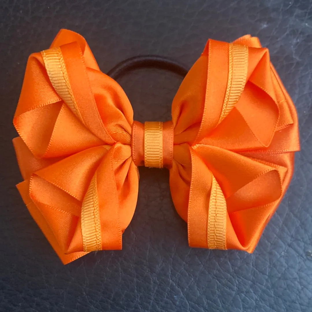 Luxury Bows: Orange bows with twist design